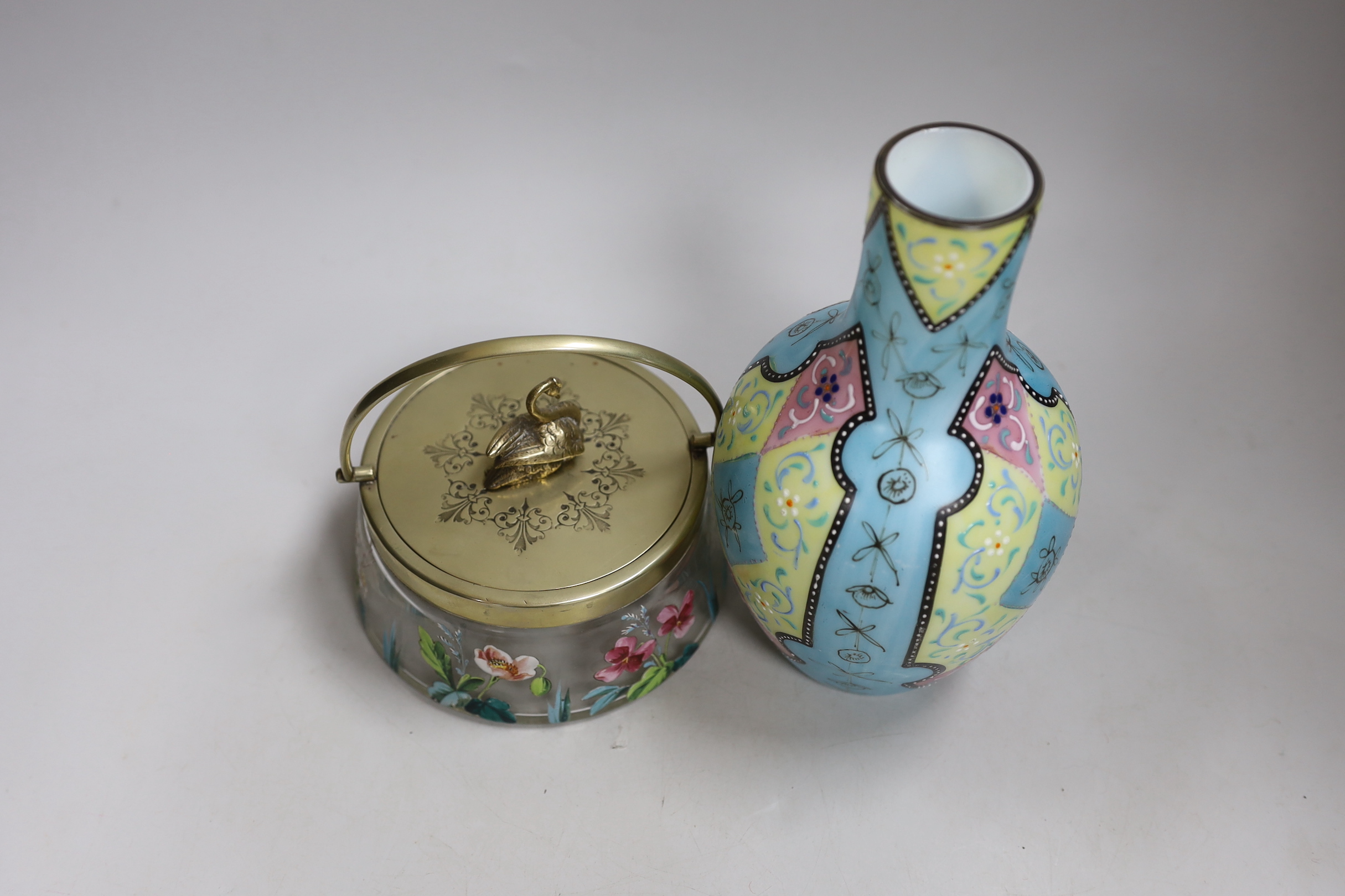 A Bohemian enamelled glass jar with silver plated cover, possibly Moser, together with a French enamelled glass vase. Tallest 20cm